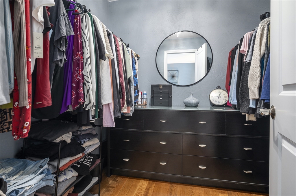 16 Farnum Street, Unit 16 Uxbridge, MA 01569 - Photo 22 of 34 a view of a closet and a mirror