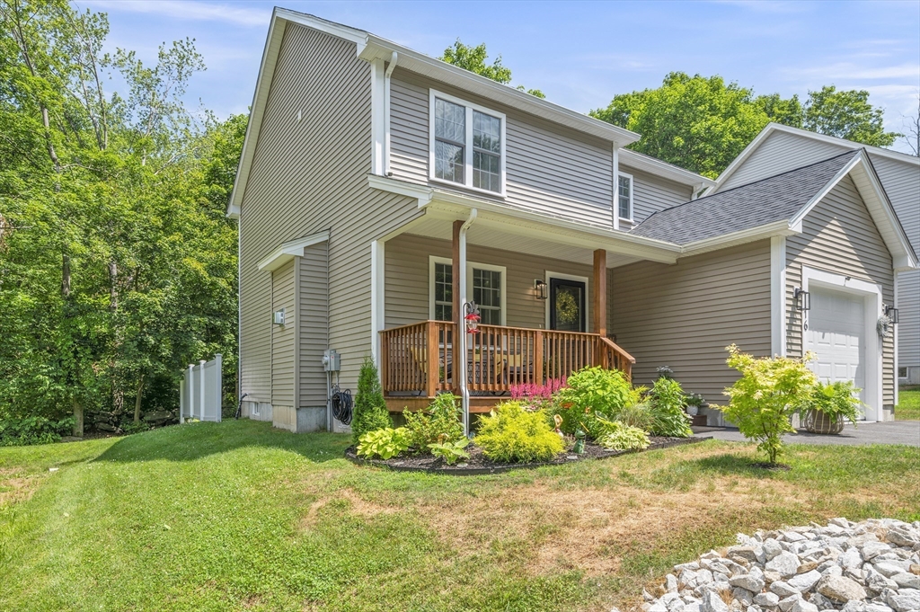 16 Farnum Street, Unit 16 Uxbridge, MA 01569 - Photo 30 of 34 front view of a house with a yard