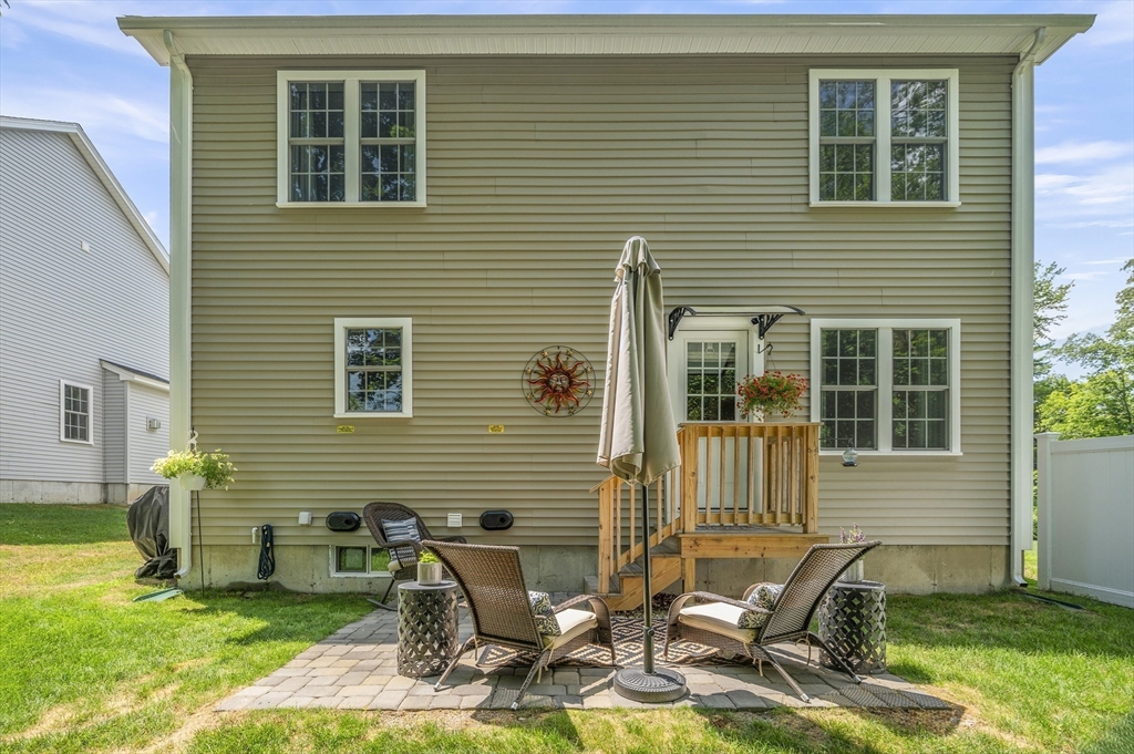 16 Farnum Street, Unit 16 Uxbridge, MA 01569 - Photo 32 of 34 a view of backyard with a chair