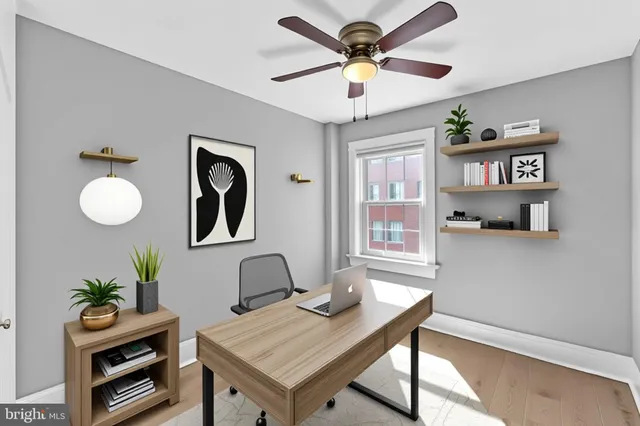 a workspace with furniture and window