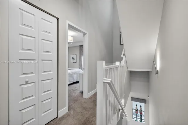 a bathroom with a sink a toilet and a large mirror