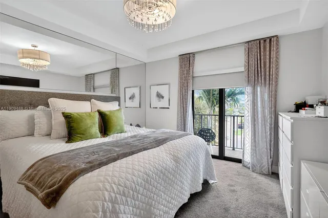 a bed room with a bed and a mirror