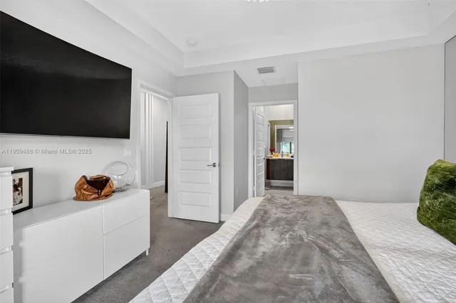 a view of a bathroom with a sink and mirror