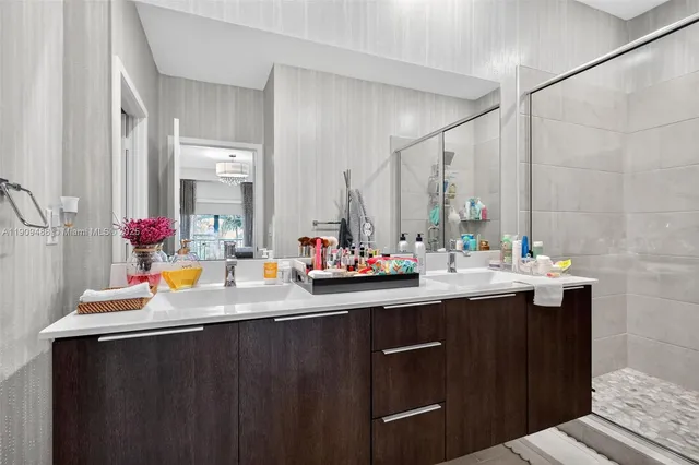 a bathroom with a sink and a shower