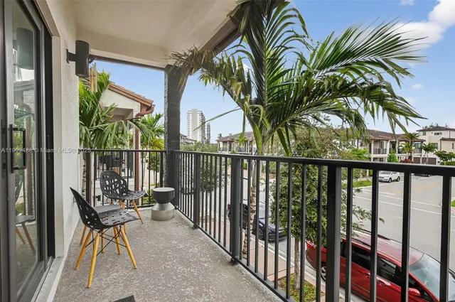 a view of multiple houses with a street