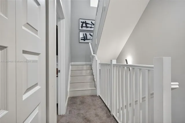 a bathroom with a sink vanity mirror and toilet