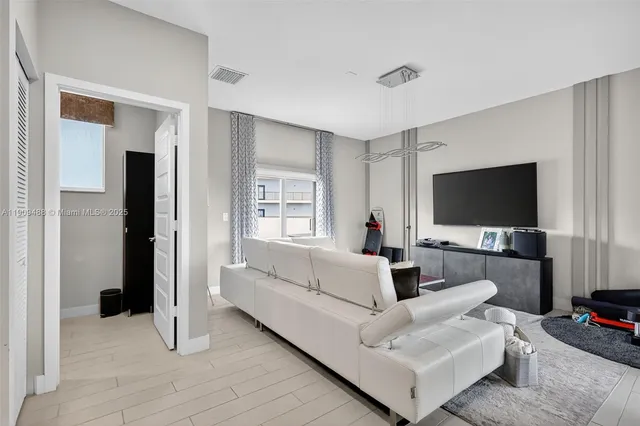 a bathroom with a sink vanity and toilet