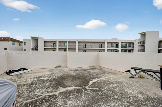 a kitchen with stainless steel appliances granite countertop a stove and a microwave