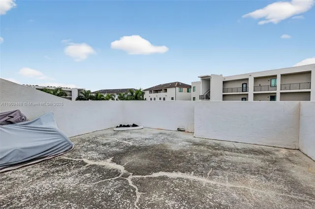 a front view of a house with a yard and balcony