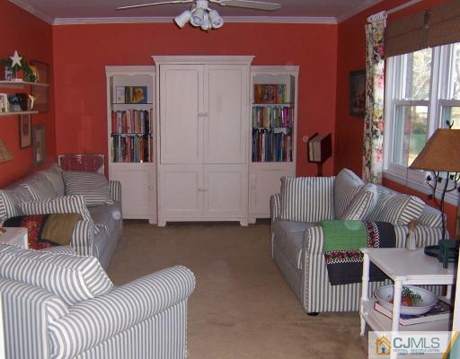 12 Bruning Road East Brunswick, NJ 08816 - Photo 3 of 9 a living room with furniture and a wooden floor