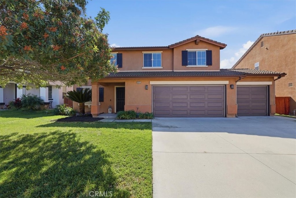 12375 Brianwood Drive Riverside, CA 92503 - Photo 1 of 1 a front view of a house with garden