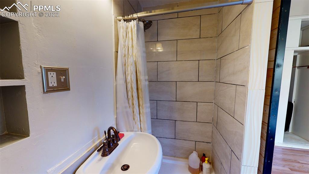 9955 Mesa Road Cascade, CO 80809 - Photo 21 of 30 a bathroom with a sink and a shower