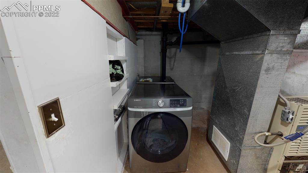 9955 Mesa Road Cascade, CO 80809 - Photo 30 of 30 a view of a storage and utility room with washer and dryer