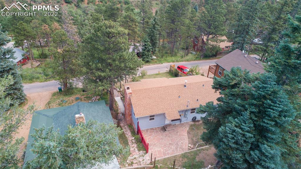 9955 Mesa Road Cascade, CO 80809 - Photo 6 of 30 an aerial view of a house with outdoor space