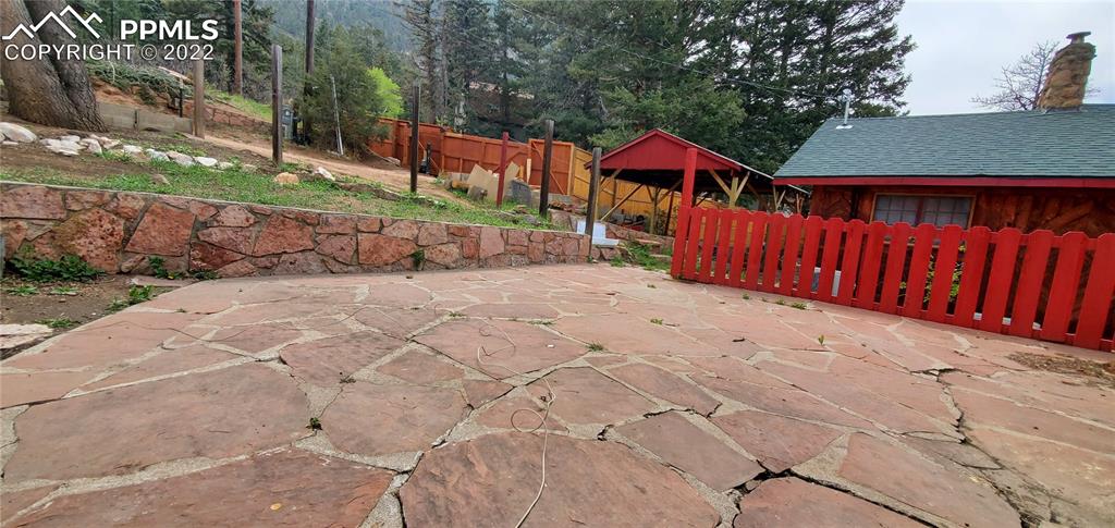 9955 Mesa Road Cascade, CO 80809 - Photo 9 of 30 a view of small yard with wooden fence