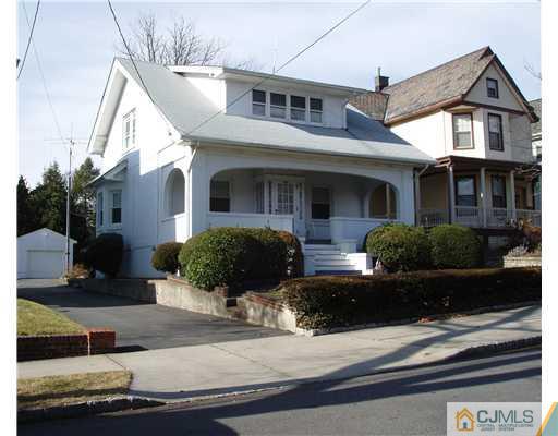145 Rector Street Perth Amboy, NJ 08861 - Photo 1 of 17 a front view of a house with yard