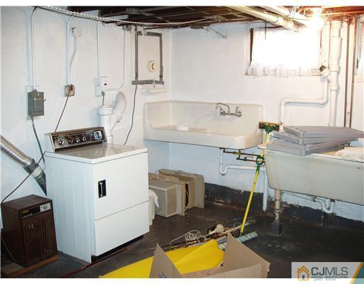 145 Rector Street Perth Amboy, NJ 08861 - Photo 16 of 17 a room with a chair and appliances