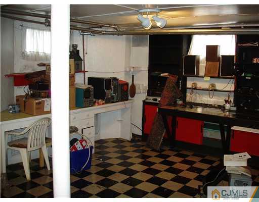 145 Rector Street Perth Amboy, NJ 08861 - Photo 17 of 17 a kitchen with a stove and a refrigerator