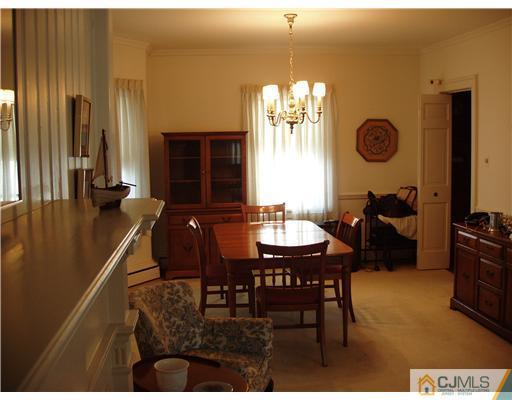 145 Rector Street Perth Amboy, NJ 08861 - Photo 7 of 17 a view of a dining room with furniture and chandelier
