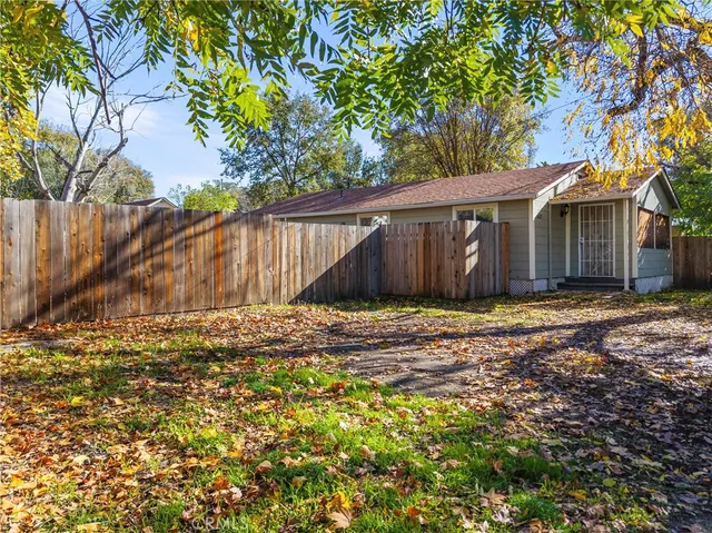 a view of a house with a tree