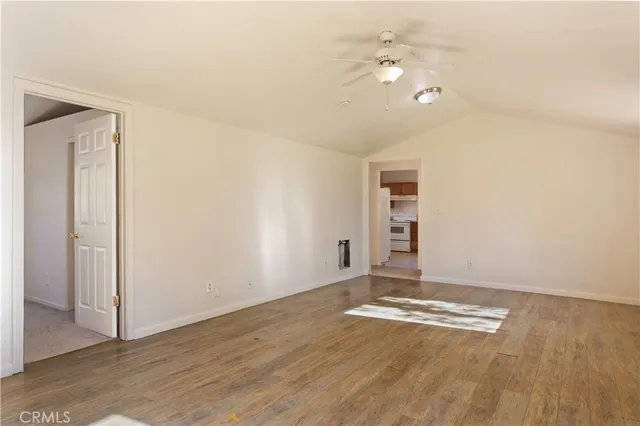 a view of a livingroom with wooden floor