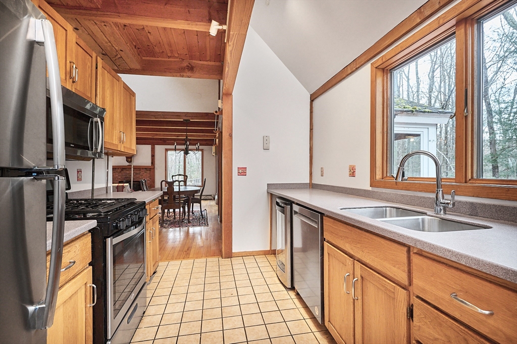 130 Coles Meadow Road Northampton, MA 01060 - Photo 11 of 42 a kitchen with a sink a stove and cabinets