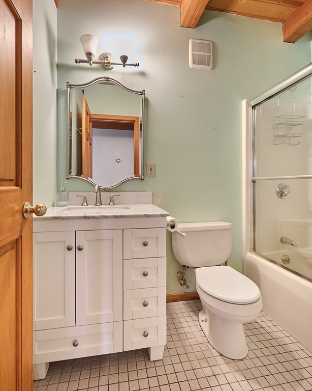 130 Coles Meadow Road Northampton, MA 01060 - Photo 16 of 42 a bathroom with a granite countertop toilet sink and mirror