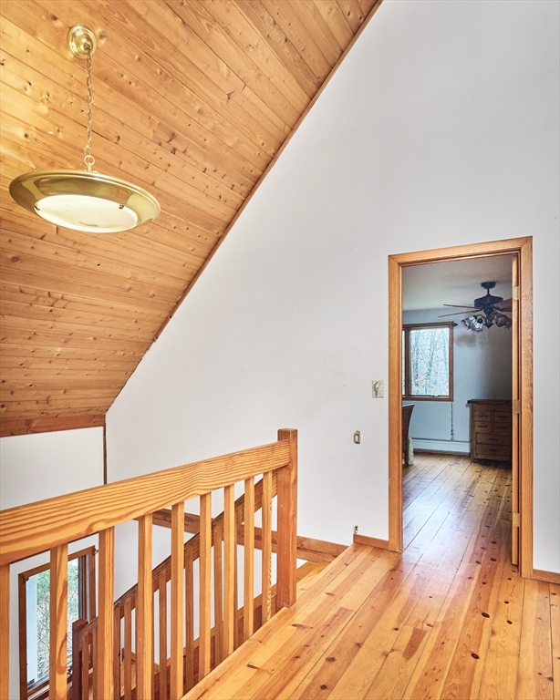 130 Coles Meadow Road Northampton, MA 01060 - Photo 17 of 42 a view of a hallway with wooden floor and staircase