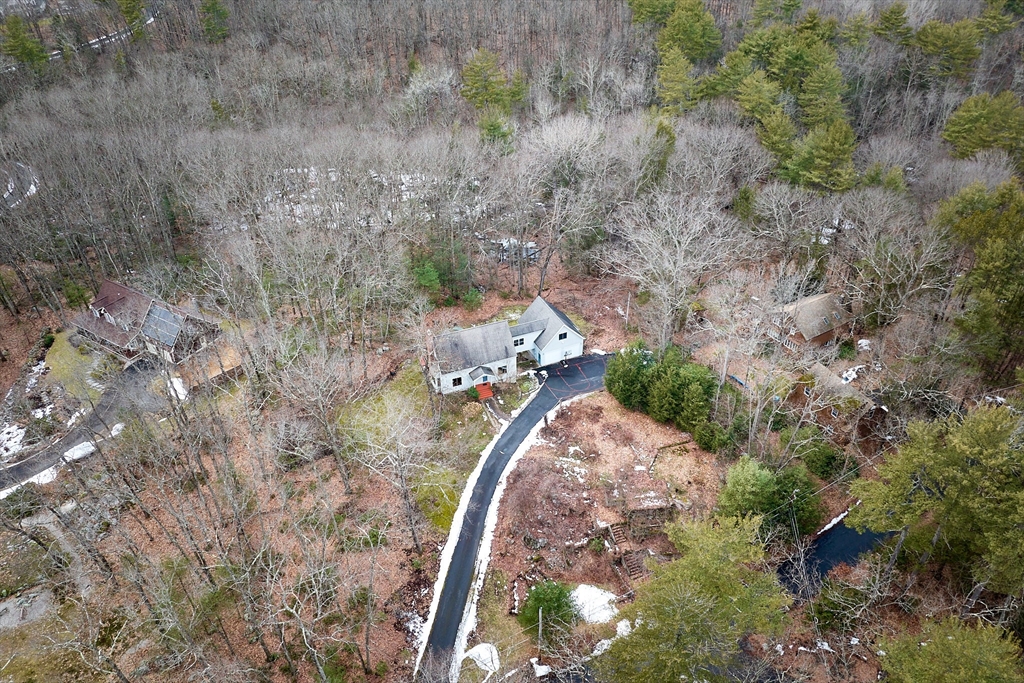 130 Coles Meadow Road Northampton, MA 01060 - Photo 37 of 42 a view of a wooden house with a yard