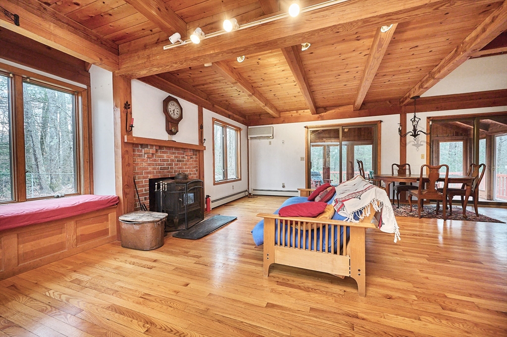 130 Coles Meadow Road Northampton, MA 01060 - Photo 8 of 42 a outdoor space with lots of furniture and a fireplace