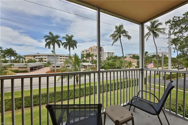 a view of a chairs and table in patio