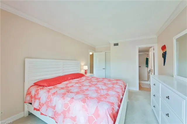 a bedroom with a bed and a cabinets