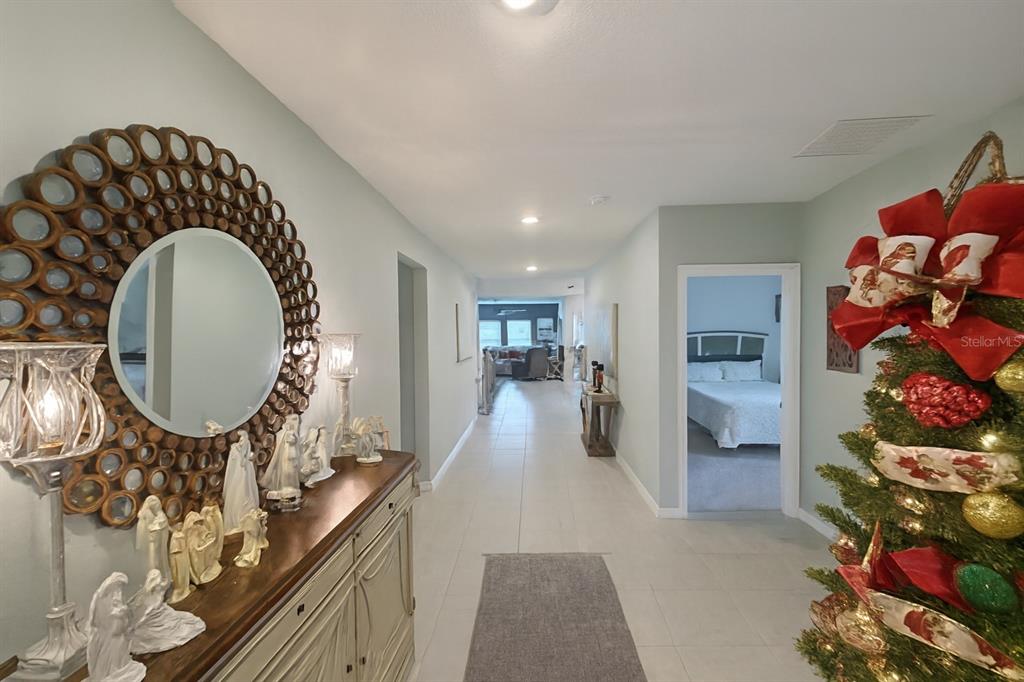 9611 Rampart Road Leesburg, FL 34788 - Photo 11 of 24 a view of a living room and entryway