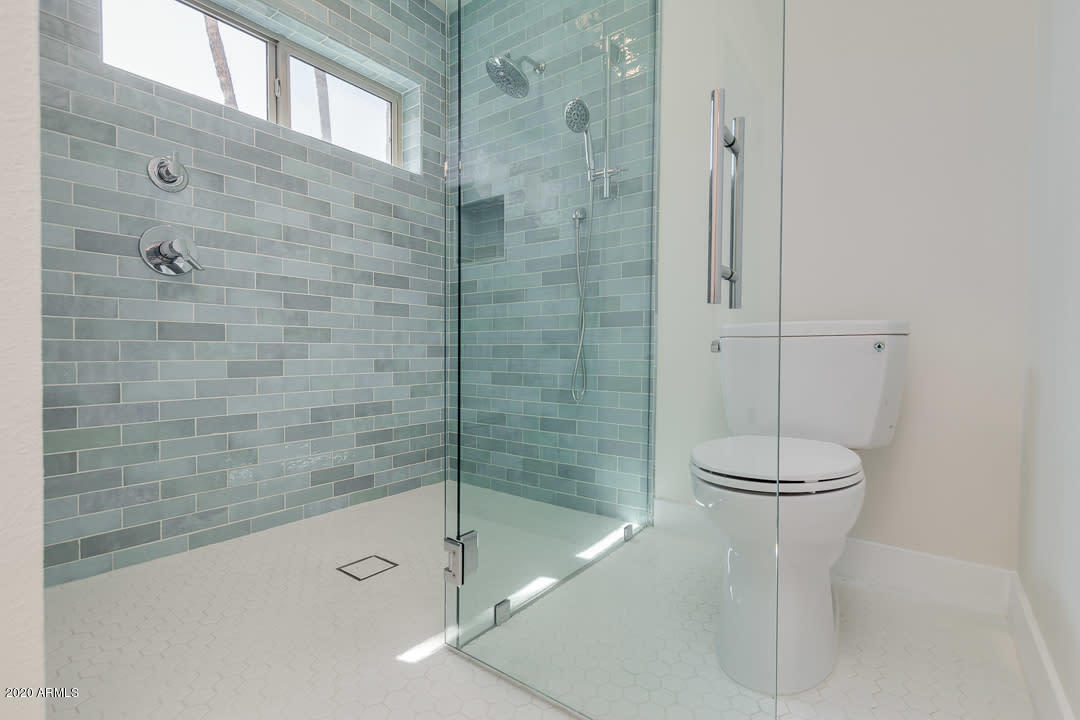 7475 East Raintree Court Scottsdale, AZ 85258 - Photo 23 of 38 a bathroom with a bathtub and a shower