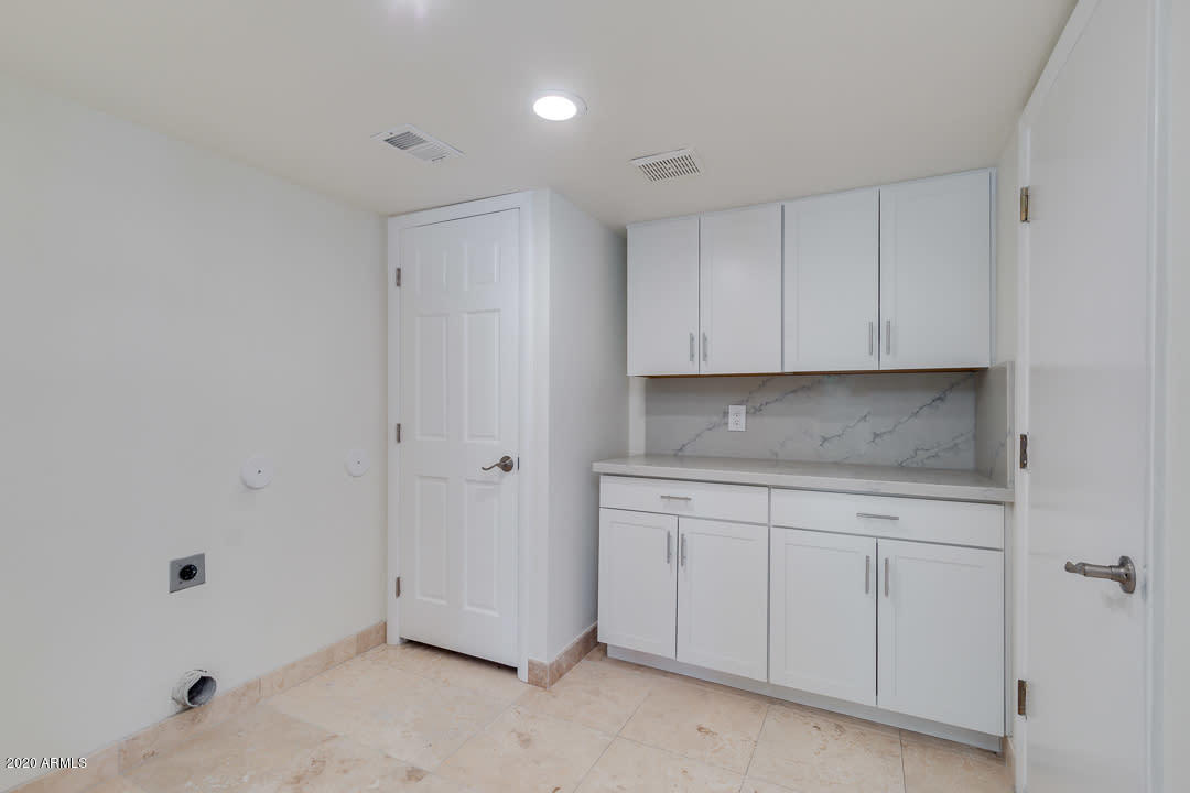 7475 East Raintree Court Scottsdale, AZ 85258 - Photo 29 of 38 a view of cabinets a sink and dishwasher in a room