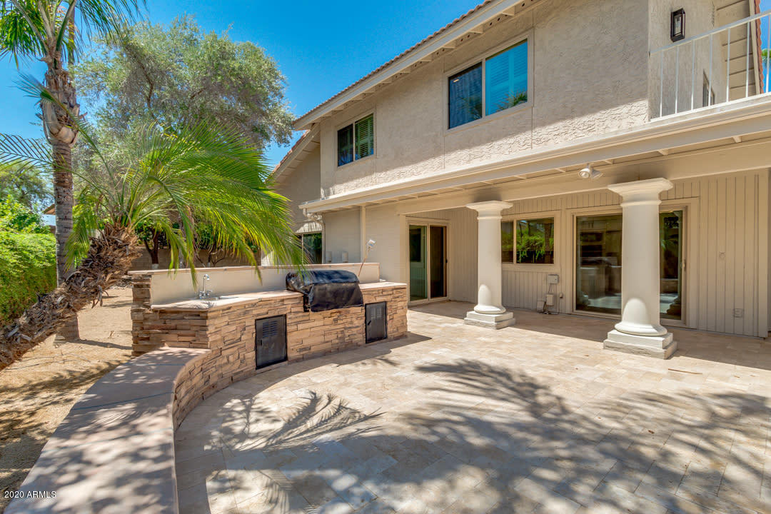 7475 East Raintree Court Scottsdale, AZ 85258 - Photo 31 of 38 a view of a terrace with couches and potted plants
