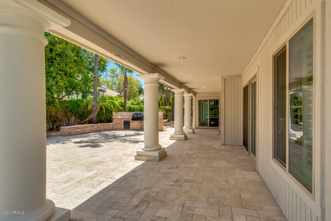 7475 East Raintree Court Scottsdale, AZ 85258 - Photo 32 of 38 a view of a room with a large window and yard