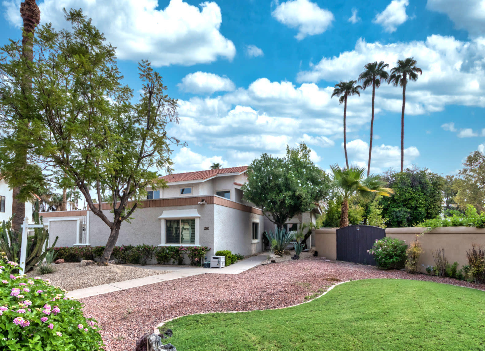 7475 East Raintree Court Scottsdale, AZ 85258 - Photo 6 of 38 a view of a house with a yard