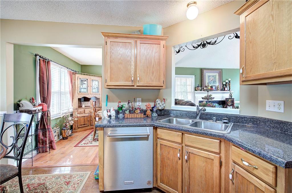 218 Gilreath Road Southeast Cartersville, GA 30121 - Photo 10 of 27 a kitchen with lots of counter top space and a sink