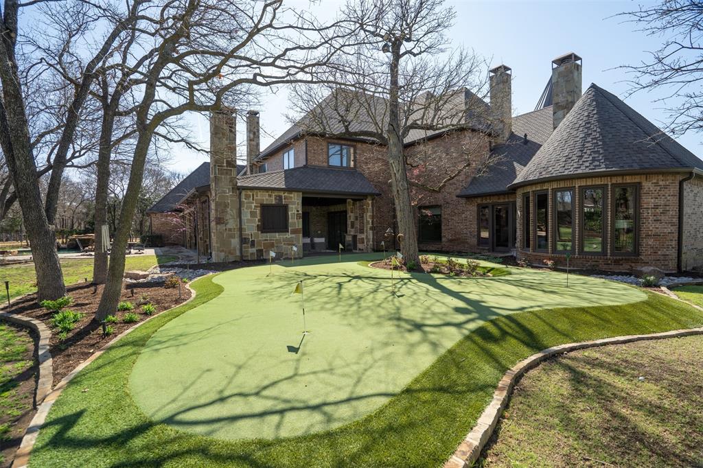 9 Victory Lane Double Oak, TX 75077 - Photo 37 of 40 Private putting green provides a fun and unique recreational feature for golf enthusiasts. The landscaped grounds create a park-like setting perfect for outdoor enjoyment.