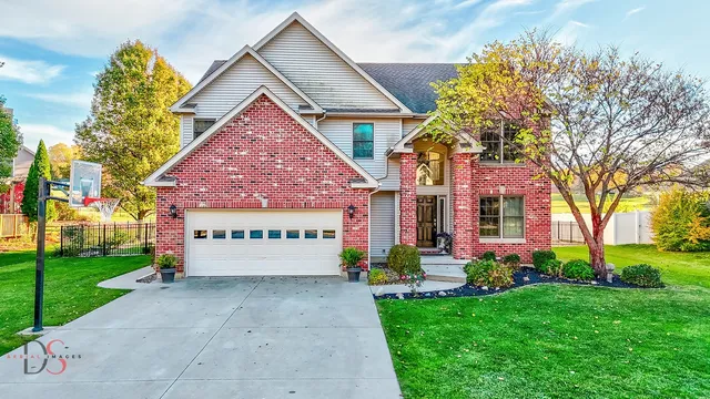 a sign board with yard in front of it