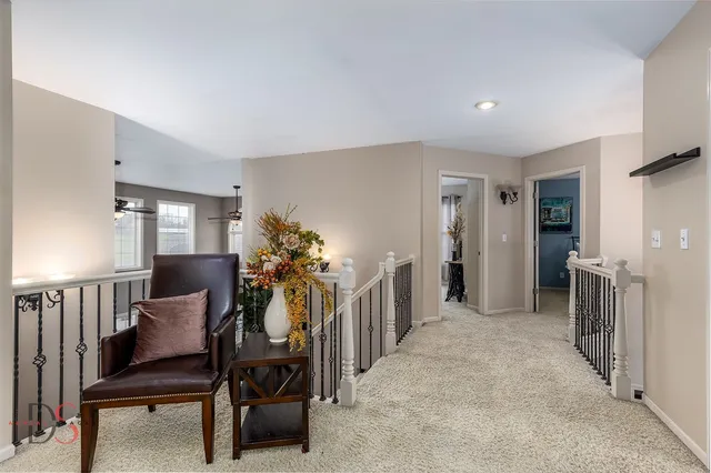 a view of a livingroom with furniture and a potted plant