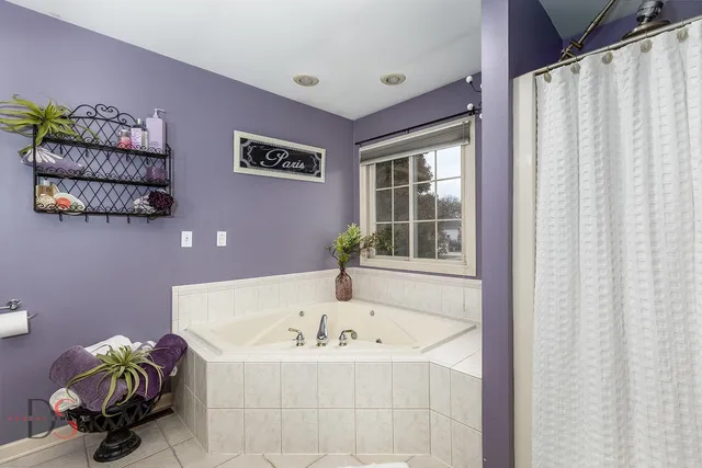 a bath tub sitting next to a window