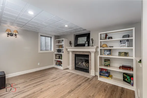 a view of livingroom with furniture and a fireplace