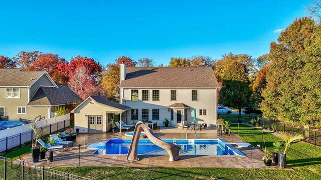 a front view of house with yard and outdoor seating