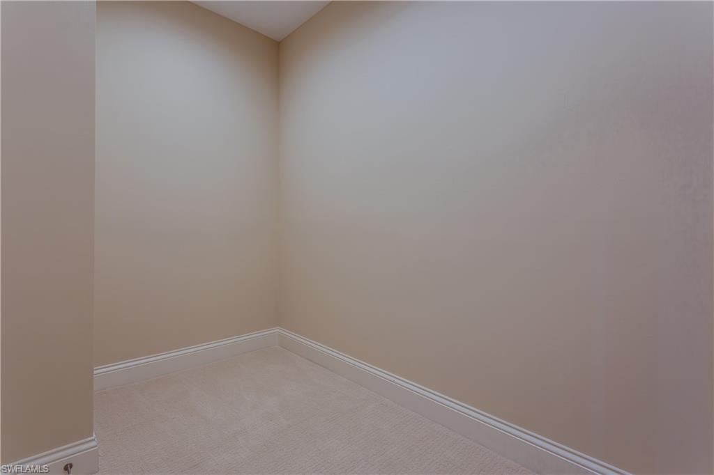 6578 Ridgewood Drive Naples, FL 34108 - Photo 17 of 35 a room that has a window