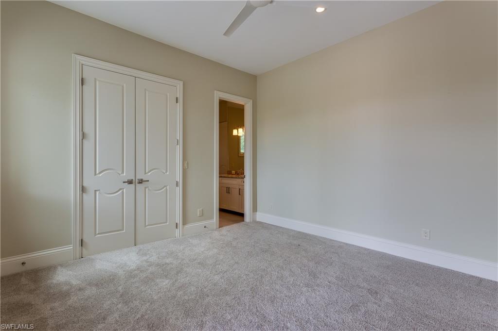 6578 Ridgewood Drive Naples, FL 34108 - Photo 20 of 35 a view of an empty room and closet area