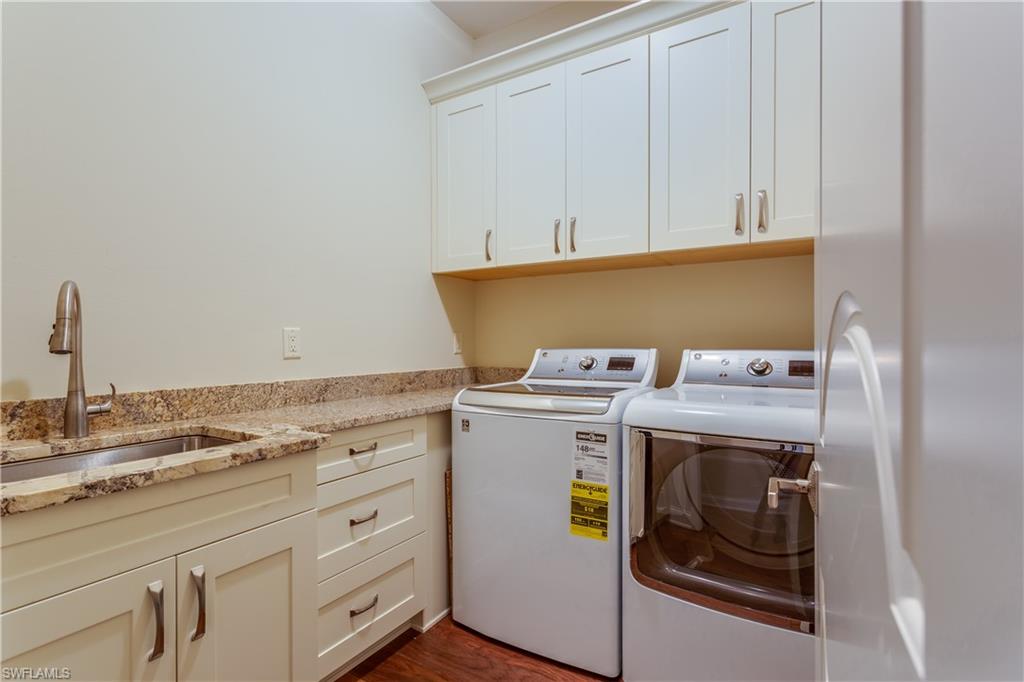 6578 Ridgewood Drive Naples, FL 34108 - Photo 28 of 35 a view of washer and dryer