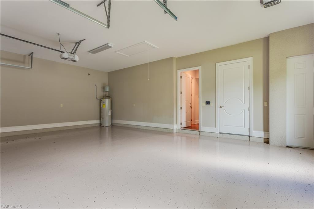 6578 Ridgewood Drive Naples, FL 34108 - Photo 29 of 35 an empty room with a ceiling fan and window
