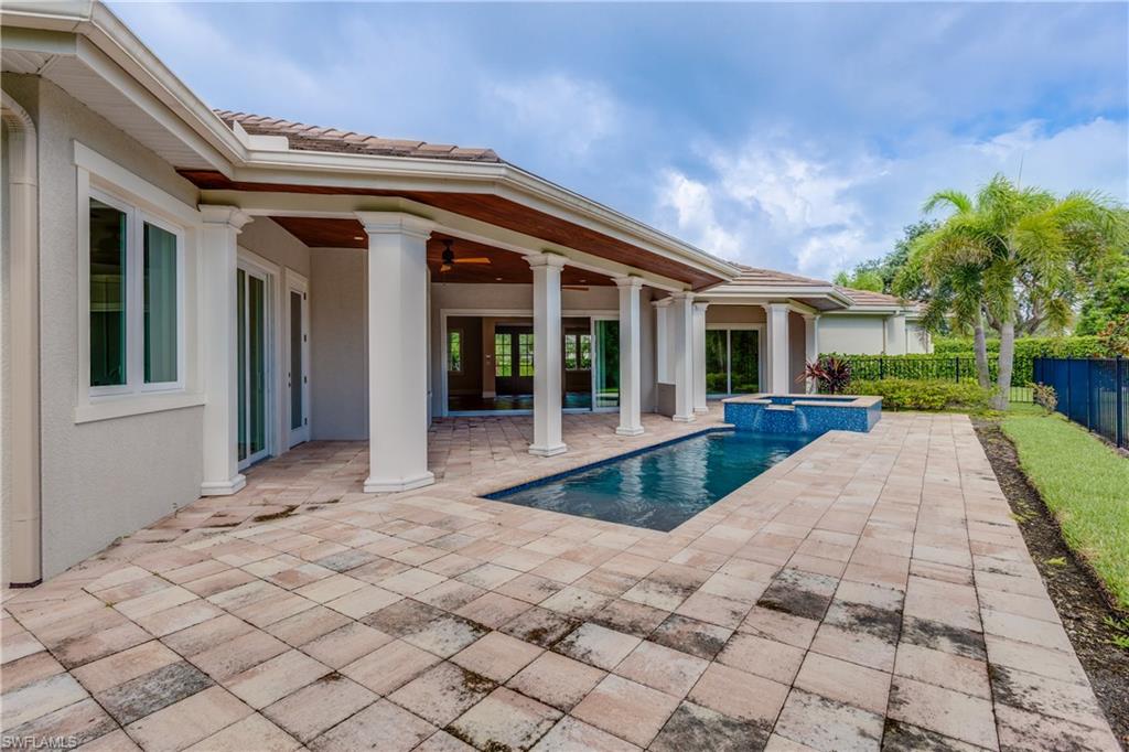 6578 Ridgewood Drive Naples, FL 34108 - Photo 32 of 35 a view of a house with a porch